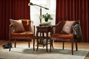 A living room with two chairs and a table