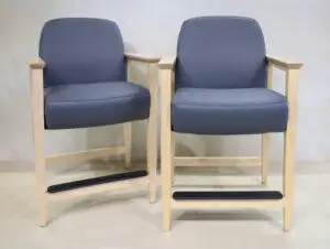 Two blue chairs are sitting in a room.